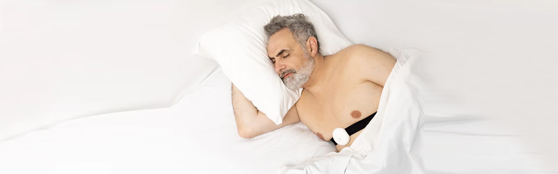 Man Sleeping with Fibion Vitals Sleep tracking wearable