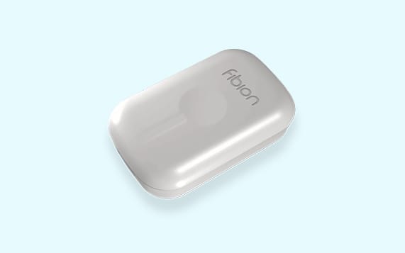 A sleek white Fibion device with rounded edges set against a light blue background.