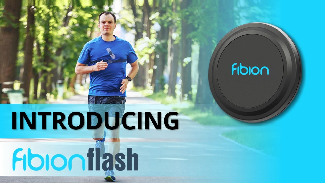 A man is jogging on a tree-lined path, holding a fitness device designed for advanced activity monitoring. The text reads "Introducing Fibion Flash.