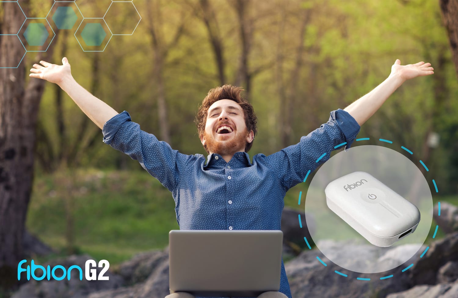 A man sits outdoors with a laptop, arms raised joyfully. Beside him, a Fibion G2 device collects accelerometer data, enhancing his digital experience with precise event markers.