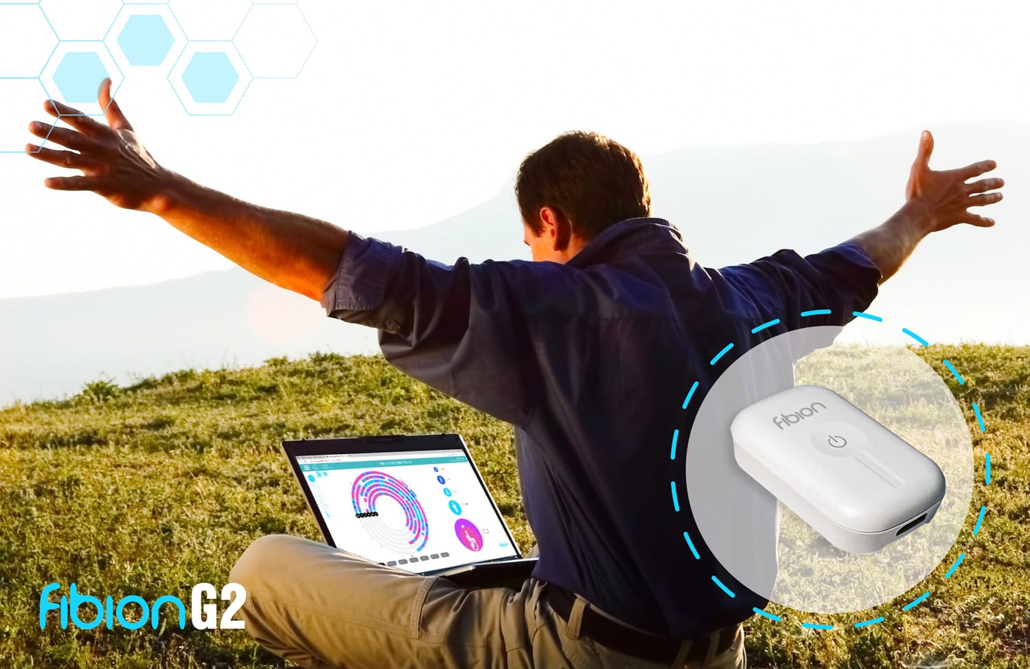 A person sits on the grass with arms outstretched, engrossed in advanced research on their laptop. In the foreground, a Fibion G2 wearable device captures tri-axial raw data, enhancing their study experience.