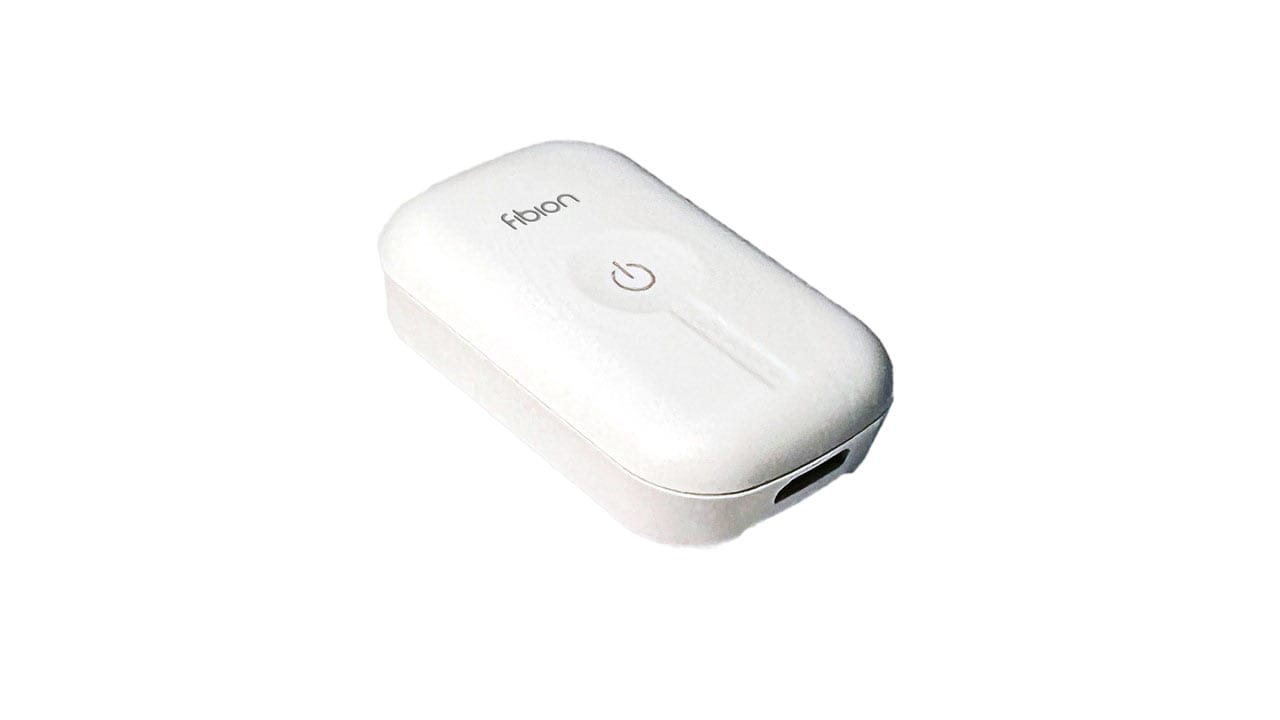 The white Fobon device, marked with a power button symbol on top, comes in a sleek rectangular shape. An essential tool for enhancing data, it features a USB port at one end to seamlessly integrate with accelerometer data and event markers for comprehensive analysis.