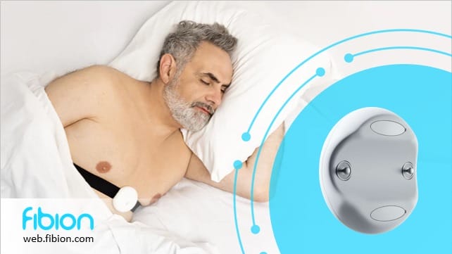 A man peacefully sleeps with a sensor attached to his chest, highlighting the efficiency of our Remote Sleep Monitoring technology. Next to him, a close-up showcases the advanced device. The Fibion logo and web link are subtly placed in the corner.