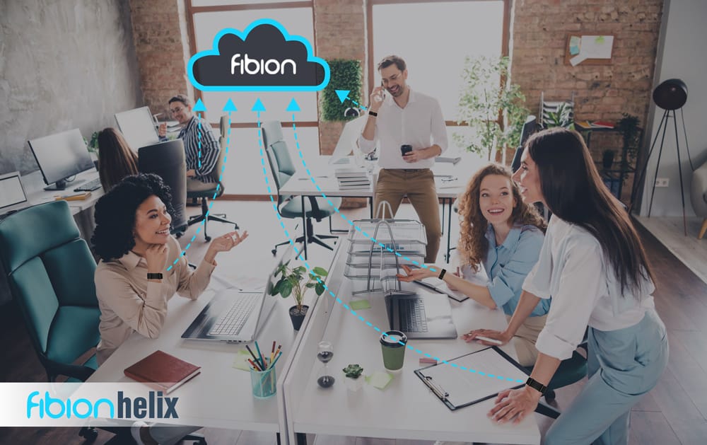 People in an office collaborate, with digital cloud connections labeled "fibion" and "SENS Motion" depicted overhead.