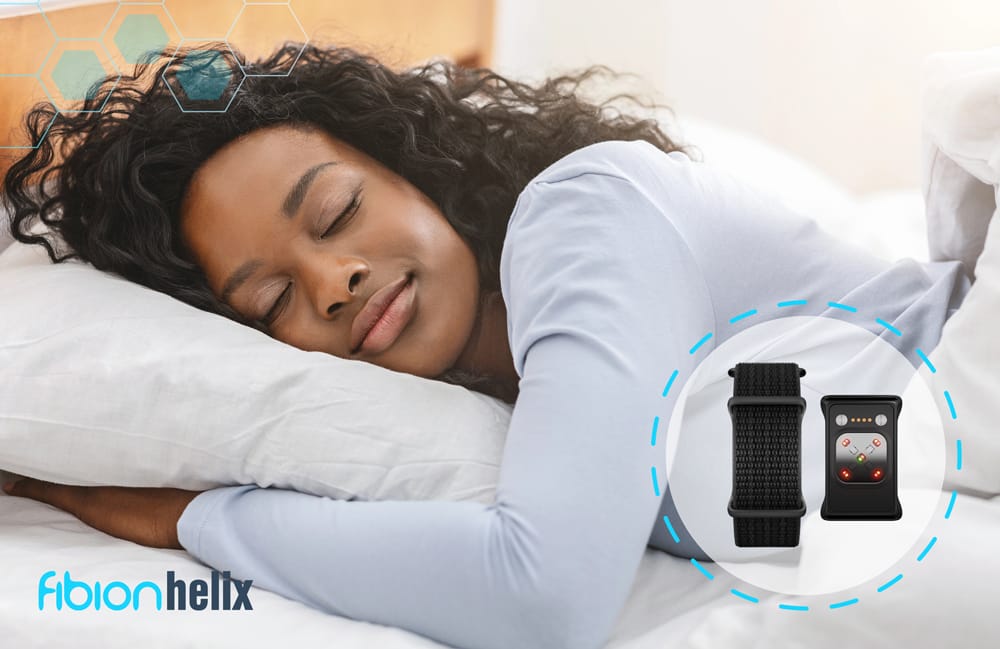 A woman sleeps peacefully on a bed, with a graphic of a fitness tracker, highlighting the SENS Motion technology, next to her. The Fibion Helix logo is elegantly placed in the corner.