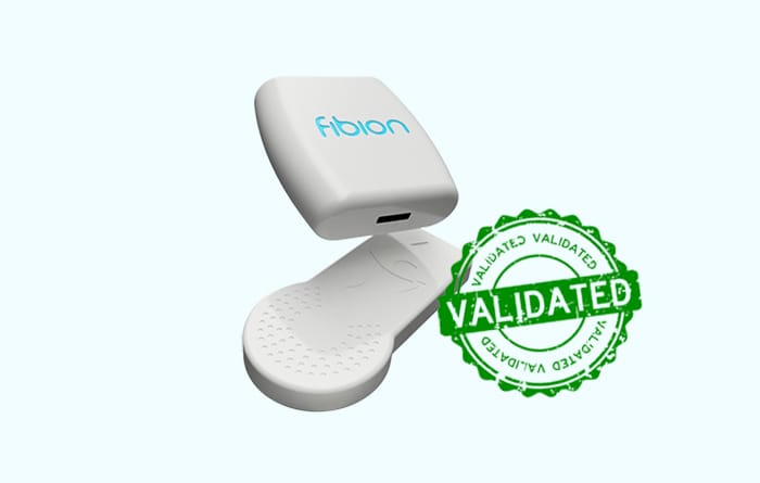 A small white device labeled "Fibion" is next to a green "Validated" stamp on a light blue background.